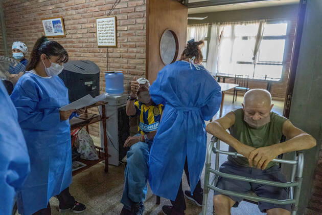 February 25, 2021, Firmat, Santa Fe, Argentina: A nurse applies India s Serum Institute Covishield vaccine against COVID-19 to an elderly man in a makeshift care home at a special school..The original care home inside San Martin Hospital was converted into the COVID-19 sector at the beginning of the pandemic and residents were transferred to a special school. Firmat Argentina - ZUMAs197 20210225_zaa_s197_110 Copyright: xPatricioxMurphyx