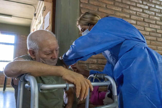February 25, 2021, Firmat, Santa Fe, Argentina: A nurse applies India s Serum Institute Covishield vaccine against COVID-19 to an elderly man in a makeshift care home at a special school..The original care home inside San Martin Hospital was converted into the COVID-19 sector at the beginning of the pandemic and residents were transferred to a special school. Firmat Argentina - ZUMAs197 20210225_zaa_s197_111 Copyright: xPatricioxMurphyx
