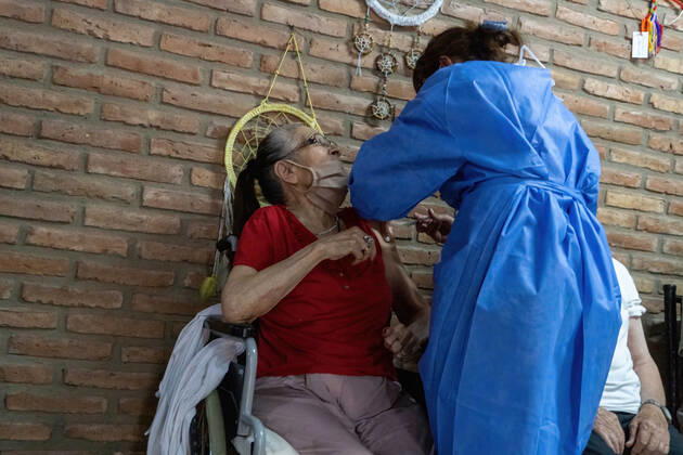 February 25, 2021, Firmat, Santa Fe, Argentina: A nurse applies India s Serum Institute Covishield vaccine against COVID-19 to an elderly woman in a makeshift care home at a special school..The original care home inside San Martin Hospital was converted into the COVID-19 sector at the beginning of the pandemic and residents were transferred to a special school. Firmat Argentina - ZUMAs197 20210225_zaa_s197_112 Copyright: xPatricioxMurphyx
