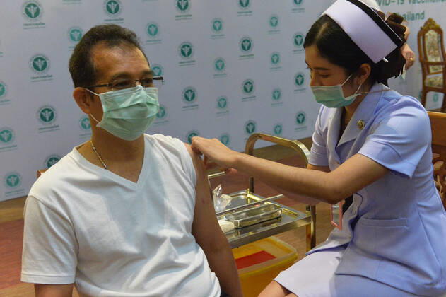 (210228) -- BANGKOK, Feb. 28, 2021 -- A man receives a shot of COVID-19 vaccine from China s Sinovac in Bangkok, Thailand, Feb. 28, 2021. Thailand on Sunday started its COVID-19 vaccination roll-out, with the first shot, using China s Sinovac vaccine, going to Deputy Prime Minister and Public Health Minister Anutin Charnvirakul. ) THAILAND-COVID-19-VACCINATION-START RachenxSageamsak 