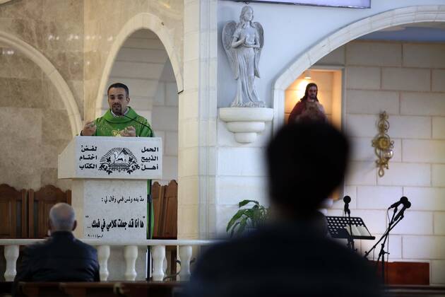 February 28, 2021, Jenin, West Bank, Palestinian Territory: Christian worshippers pray inside Church, amid the coronavirus lockdown in the town of Zababdeh, south of Jenin, in the West Bank on February 28, 2021. Prime Minister Mohammad Shtayyeh announced a new set of restrictions in response to a recent surge in coronavirus infections, including of British and South African mutants, in Palestine.A lockdown of all public and private schools for all classes, except for high school students for a period of 12 days, including kindergartens..A lockdown of all universities, educational and vocational institutes and shifting to distance e-learning programs. A maximum of 50 percent of administrative staff are allowed access to universities..Movemen - ZUMAap3_ 20210228_zaf_ap3_054 Copyright: xOdayxDaibesx
