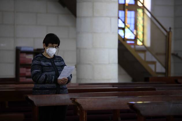 February 28, 2021, Jenin, West Bank, Palestinian Territory: Christian worshippers pray inside Church, amid the coronavirus lockdown in the town of Zababdeh, south of Jenin, in the West Bank on February 28, 2021. Prime Minister Mohammad Shtayyeh announced a new set of restrictions in response to a recent surge in coronavirus infections, including of British and South African mutants, in Palestine.A lockdown of all public and private schools for all classes, except for high school students for a period of 12 days, including kindergartens..A lockdown of all universities, educational and vocational institutes and shifting to distance e-learning programs. A maximum of 50 percent of administrative staff are allowed access to universities..Movemen - ZUMAap3_ 20210228_zaf_ap3_059 Copyright: xOdayxDaibesx