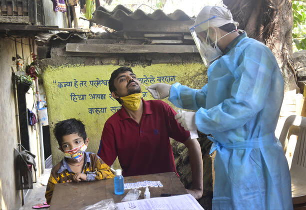 MUMBAI, INDIA - FEBRUARY 27: BMC medical staff conducts swab test of resident staying in Sewri, on February 28, 2021 in Mumbai, India. (Photo by Anshuman Poyrekar Hindustan Times) Medical Team Conducts COVID-19 Coronavirus Test