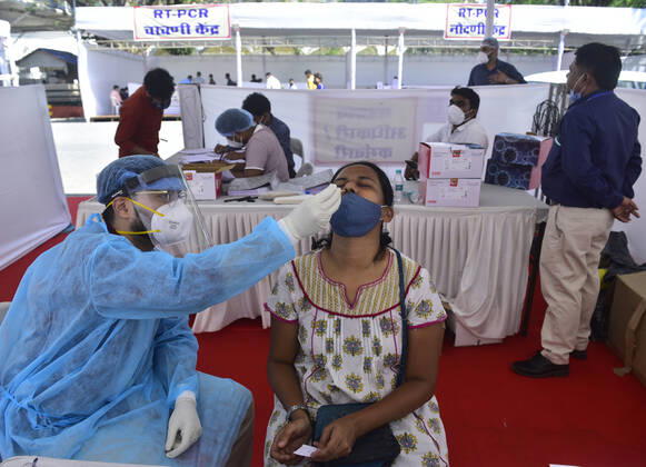 MUMBAI, INDIA - FEBRUARY 28: BMC medical staff conducts swab test of employees, Media person and security personnel assigned for Budget Session at Vidhan Bhavan, on February 28, 2021 in Mumbai, India. (Photo by Anshuman Poyrekar Hindustan Times) Medical Team Conducts COVID-19 Coronavirus Test