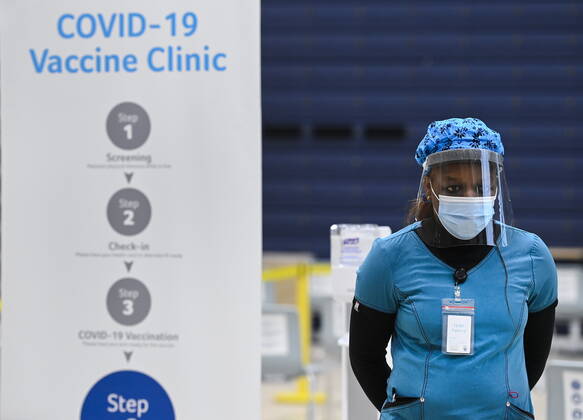 March 1, 2021, Mississauga, on, Canada: A health-care worker stands in the post vaccine waiting area at a mass COVID-19 vaccination clinic for Peel Region during the COVID-19 pandemic in Mississauga, Ont., on Monday, March 1, 2021. Mississauga Canada  - ZUMAc35_ 20210301_zaf_c35_061 Copyright: xNathanxDenettex