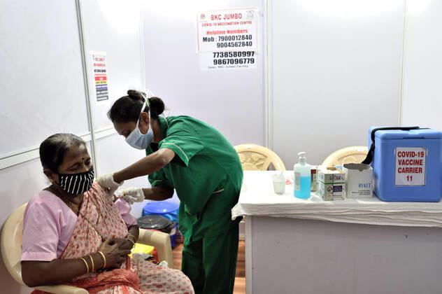 MUMBAI, INDIA - MARCH 1: A senior citizen getting their first dose of a Covid-19 vaccination, at BKC on March 1, 2021 in Mumbai, India. India?s Covid-19 vaccination drive was extended today to include the elderly and those with co-morbidities. (Photo by Satish Bate Hindustan Times) Covid Vaccination Phase 2 Starts In India