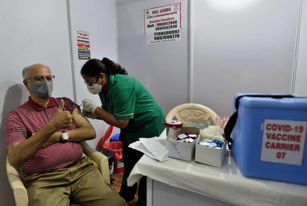 MUMBAI, INDIA - MARCH 1: A senior citizen getting their first dose of a Covid-19 vaccination, at BKC on March 1, 2021 in Mumbai, India. India?s Covid-19 vaccination drive was extended today to include the elderly and those with co-morbidities. (Photo by Satish Bate Hindustan Times) Covid Vaccination Phase 2 Starts In India