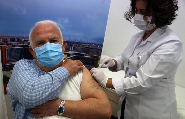 (210302) -- ANKARA, March 2, 2021 -- A man receives the COVID-19 vaccine in Ankara, Turkey on March 1, 2021. Turkey on Monday reported 9,891 new COVID-19 cases, including 645 symptomatic ones, raising the total number in the country to 2,711,479, according to the health ministry. The country started mass vaccination for COVID-19 on Jan. 14 after the authorities approved the emergency use of the Chinese CoronaVac vaccine. About 7,046,000 people have been vaccinated so far. (Photo by Xinhua) TURKEY-ANKARA-COVID-19-VACCINATION MustafaxKaya