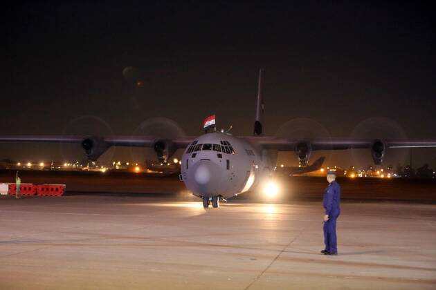 (210302) -- BAGHDAD, March 2, 2021 -- A plane carrying the COVID-19 vaccines donated by China arrives at an airbase in Baghdad, Iraq on March 2, 2021. Iraq received a shipment of China s COVID-19 vaccines on Tuesday. ) IRAQ-BAGHDAD-COVID-19-CHINA-VACCINES-ARRIVAL KhalilxDawood 