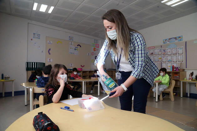 (210302) -- ANKARA, March 2, 2021 -- A teacher gives props to a student in a kindergarten in Ankara, Turkey on March 2, 2021. Turkey on Tuesday reported 11,837 new COVID-19 cases, including 668 symptomatic patients, as its daily infections exceeded 10,000 for the first time in about two months. (Photo by Xinhua) TURKEY-ANKARA-COVID-19-CASES MustafaxKaya 