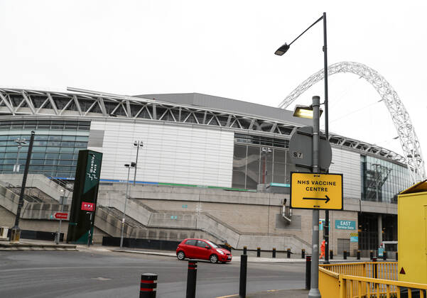 (210305) -- LONDON, March 5, 2021 -- Photo taken on March 4, 2021 shows a sign for an NHS COVID-19 vaccination center in London, Britain. Future vaccines that have been tweaked to deal with new coronavirus variants will be fast-tracked for authorization, Britain s medicines and health care regulator announced Thursday. ) BRITAIN-LONDON-COVID-19-VACCINE HanxYan 