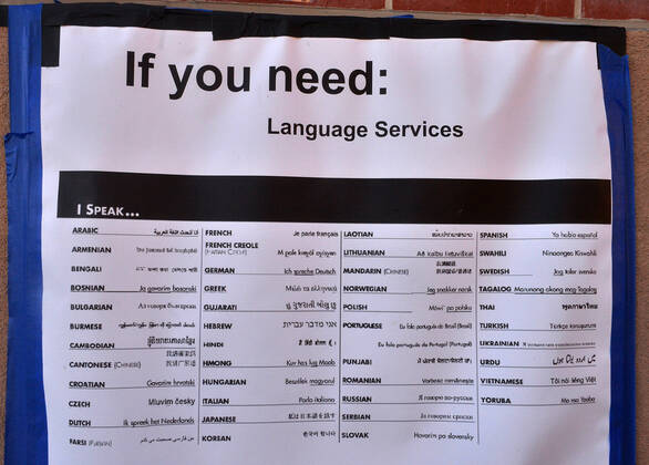 A sign posted on a wall outside the FEMA walk-on vaccination site apprises local residents about available language services at the Cal State LA campus in Los Angeles on Thursday, March 4, 2021. California will begin sending 40% of all vaccine doses to the most vulnerable neighborhoods in the state to try to inoculate people most at risk from the coronavirus and get the state s economy open more quickly, Gov. Gavin Newsom said Thursday in the latest shake-up to the state s rules.  LAP2021030435 JIMxRUYMEN