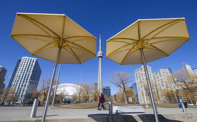 (210305) -- TORONTO, March 5, 2021 -- People walk in a park in Toronto, Canada, on March 5, 2021. The global COVID-19 pandemic, including the associated restrictions and lockdowns over the past 12 months, have resulted in 8.35 billion Canadian dollars (about 6.6 billion U.S. dollars) in lost economic activity from visitor spending in Toronto, according to a press release by Destination Toronto on Thursday. (Photo by Xinhua) CANADA-TORONTO-COVID-19-TOURISM ZouxZheng 