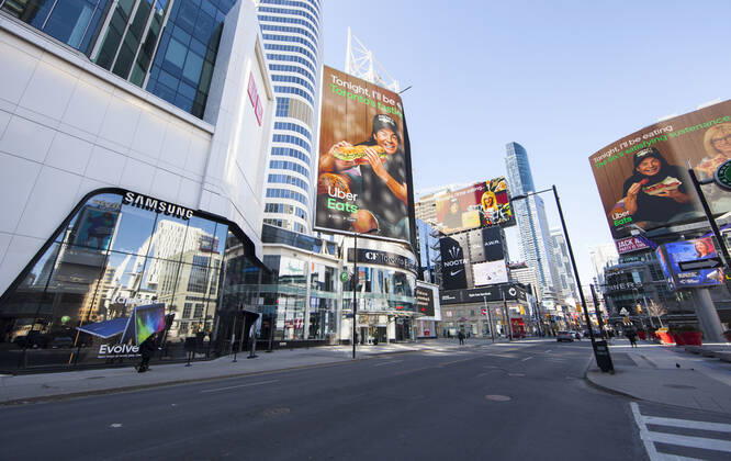 (210305) -- TORONTO, March 5, 2021 -- Few people are seen at Yonge-Dundas Square in Toronto, Canada, on March 5, 2021. The global COVID-19 pandemic, including the associated restrictions and lockdowns over the past 12 months, have resulted in 8.35 billion Canadian dollars (about 6.6 billion U.S. dollars) in lost economic activity from visitor spending in Toronto, according to a press release by Destination Toronto on Thursday. (Photo by Xinhua) CANADA-TORONTO-COVID-19-TOURISM ZouxZheng 
