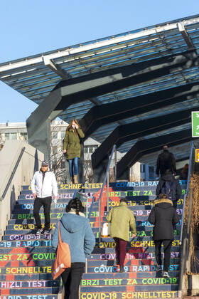 people go up steps to free COVID-19 rapid test from the City of Vienna in Austria Center Vienna, stages with the imprint COVID-19 rapid test Wien, Vienna Wien Austria 22. Donaustadt