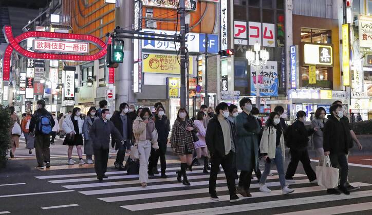 Crowded Tokyo amid virus pandemic People wearing face masks walk in Tokyo s Shinjuku area on March 6, 2021, a day after the Japanese government extended the COVID-19 state of emergency for Tokyo and three neighboring prefectures for two weeks. 