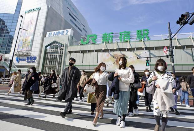 Crowded Tokyo amid virus pandemic People wearing face masks walk in Tokyo s Shinjuku area on March 6, 2021, a day after the Japanese government extended the COVID-19 state of emergency for Tokyo and three neighboring prefectures for two weeks. 