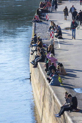 people sit in the sun at canal Donaukanal Wien, Vienna Wien Austria 02. Leopoldstadt