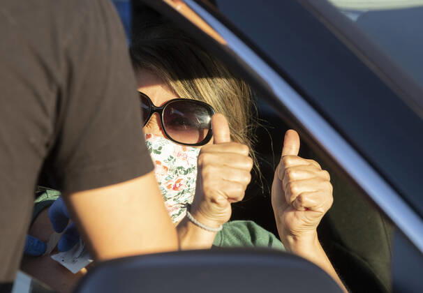 March 7, 2021, Round Rock, Texas, USA: Round Rock, TX USA March 6, 2021: A vaccinated woman gives a double thumbs up as Williamson County hosts a 24-hour vaccine marathon to catch up with COVID-19 vaccination schedule after last month s devastating winter storm that crippled much of Texas. The goal was to vaccinate up to 7,000 Texans with first or second Moderna doses. Round Rock USA - ZUMAd150 20210307_znp_d150_012 Copyright: xBobxDaemmrichx