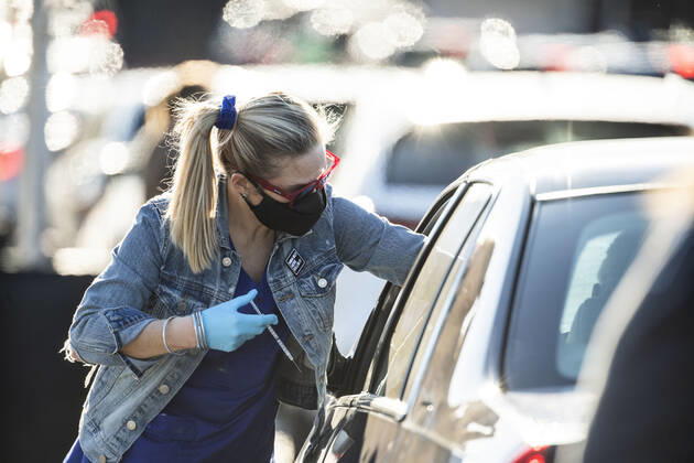 March 7, 2021, Round Rock, Texas, USA: Round Rock, TX USA March 6, 2021: Registered Nurse Stephanee Carter delivers Moderna vaccine to patients at a Williamson County 24-hour vaccine marathon, catching up with the COVID-19 vaccination schedule following February s devastating winter storm that crippled Texas. The goal set was vaccinations for 7,000 Texans with first or second Moderna doses. Round Rock USA - ZUMAd150 20210307_znp_d150_025 Copyright: xBobxDaemmrichx