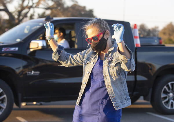 March 7, 2021, Round Rock, Texas, USA: Round Rock, TX USA March 6, 2021: Nurse STEPHANIE CARTER dances to music as Williamson County hosts a 24-hour vaccine marathon to catch up with COVID-19 vaccination schedule after last month s devastating winter storm that crippled much of Texas. The goal was to vaccinate up to 7,000 Texans with first or second Moderna doses. Round Rock USA - ZUMAd150 20210307_znp_d150_053 Copyright: xBobxDaemmrichx