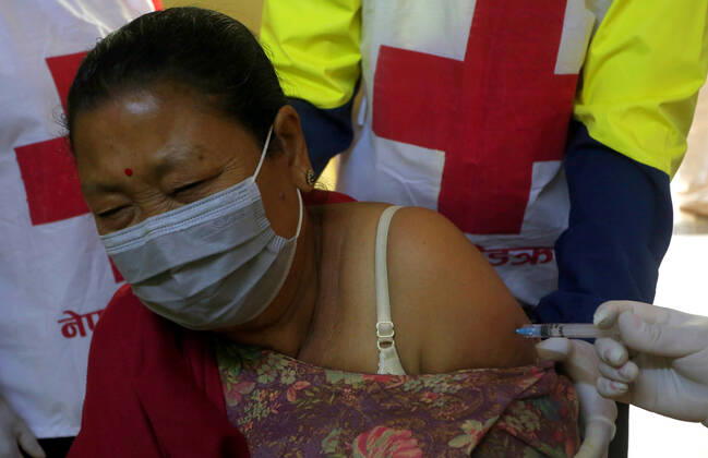 March 8, 2021, Kathmandu, Bagmati, Nepal: An elderly woman receives a dose of Covishield COVID-19 vaccine at a hospital in Kathmandu,Nepal on March 8, 2021. Nepal started the nationwide campaign to inoculate the elderly population,over 65 years with with Covishield,the Oxford-AstraZeneca vaccine. Kathmandu Nepal - ZUMAs233 20210308_zap_s233_004 Copyright: xSunilxSharmax