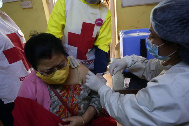 March 8, 2021, Kathmandu, Bagmati, Nepal: A female health worker gives a dose of Covishield COVID-19 vaccine to an elderly woman on International Women s Day at a hospital in Kathmandu,Nepal on March 8, 2021. Kathmandu Nepal - ZUMAs233 20210308_zap_s233_008 Copyright: xSunilxSharmax