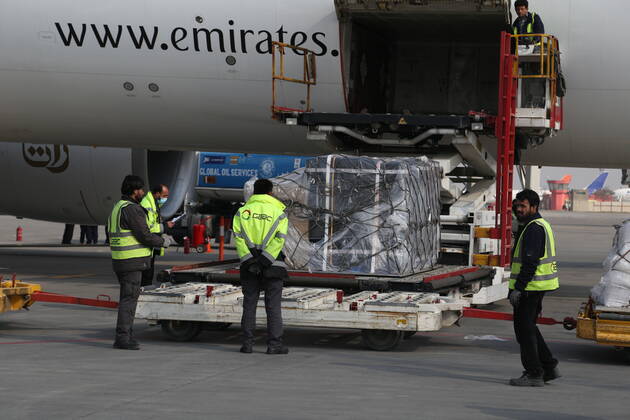 (210308) -- KABUL, March 8, 2021 -- Airport workers unload COVID-19 vaccines from COVAX, an international program devised to help low and middle-income countries to have more access to COVID-19 vaccines, at Hamid Karzai International Airport in Kabul, capital of Afghanistan, March 8, 2021. (Photo by Xinhua) AFGHANISTAN-KABUL-COVID-19 VACCINE-COVAX SayedxMominzadah 