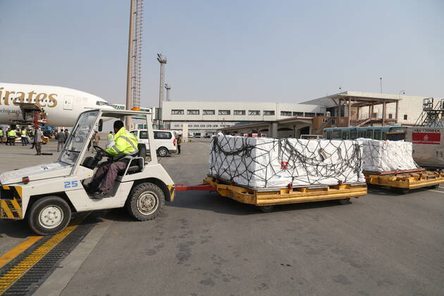 (210308) -- KABUL, March 8, 2021 -- An airport worker transports COVID-19 vaccines from COVAX, an international program devised to help low and middle-income countries to have more access to COVID-19 vaccines, at Hamid Karzai International Airport in Kabul, capital of Afghanistan, March 8, 2021. (Photo by Xinhua) AFGHANISTAN-KABUL-COVID-19 VACCINE-COVAX SayedxMominzadah 