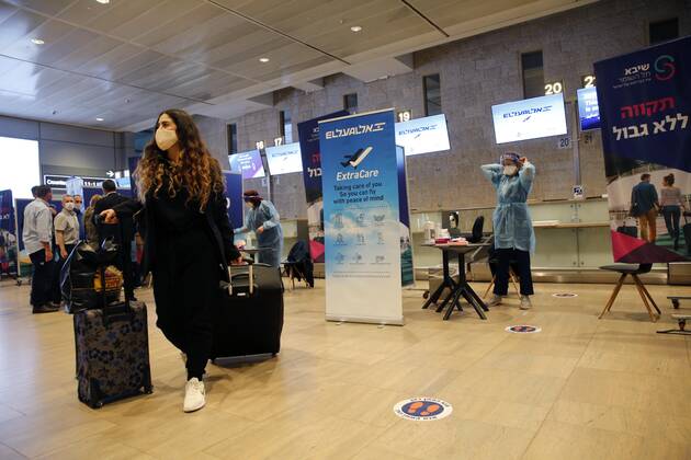 (210309) -- TEL AVIV, March 9, 2021 -- A traveler arrives at Ben Gurion International Airport near Tel Aviv, Israel, on March 8, 2021. Israel on Monday lifted the ban on entry of foreign nationals into the country, according to a statement issued by Israel s Population and Immigration Authority. ( via Xinhua) ISRAEL-AIRPORT-COVID-19-CONTROL MEASURES GilxCohenxMagen 