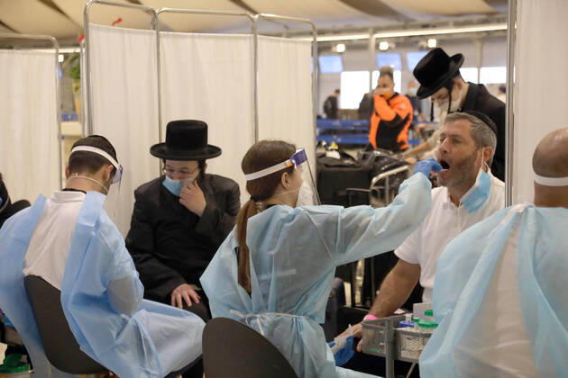 (210309) -- TEL AVIV, March 9, 2021 -- Travelers receive COVID-19 test upon their arrival at Ben Gurion International Airport near Tel Aviv, Israel, on March 8, 2021. Israel on Monday lifted the ban on entry of foreign nationals into the country, according to a statement issued by Israel s Population and Immigration Authority. ( via Xinhua) ISRAEL-AIRPORT-COVID-19-CONTROL MEASURES GideonxMarkowicz JINI 