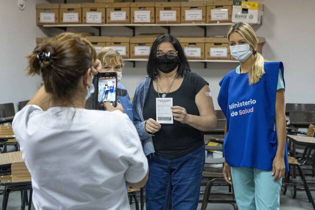 March 9, 2021, Firmat, Santa Fe, Argentina: After receiving a shot of the Sinopharm vaccine against COVID-19 inside San Martin Hospita, a teacher gets a picture with the vaccination team. As the global immunization campaign carries-on, Argentina has now specifically targeted education workers ahead of the return to school. Firmat Argentina - ZUMAm105 20210309_zaf_m105_014 Copyright: xPatricioxMurphyx