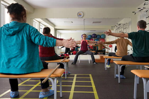 CHEBOKSARY, RUSSIA â€“ MARCH 9, 2021: Patients during a physiotherapeutic physical training session in the Chuvashiyakurort sanatorium. The sanatorium delivers rehabilitation and care to patients after COVID-19. Chuvashiakurort offers hydrotherapy and mud bath therapy in combination with traditional sanatorium services and state-of-the-art medical technology. The unique feature of the sanatorium is therapeutic sapropelic mud from Kogoyar Lake, which is situated near the Volga River. Semyon Antonov TASS  TS0F8F15