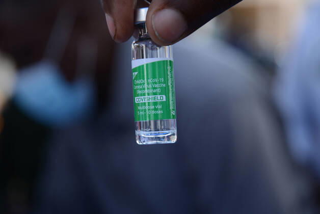 March 9, 2021, Nairobi, Kenya: A healthcare worker holds a Oxford AstraZeneca COVID-19 vaccine vial at Mutuini Hospital in Nairobi. .Kenya on March 3, 2021 received its first batch of 1.02 million doses of Oxford AstraZeneca through global COVAX scheme as part of the 24 million doses the country is expected to import in a couple of months. The vaccine which is currently being distributed to various stations across the country will first be administered to healthcare workers, teachers and people whose immunity is compromised. Nairobi Kenya - ZUMAs197 20210309_zaa_s197_041 Copyright: xDennisxSigwex