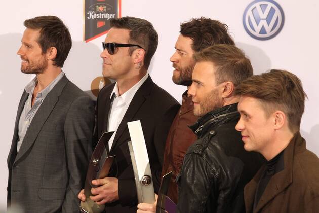 Preistraeger Take That mit Robbie Williams beim Echo 2011 - dem Deutschen Musikpreis an der Preistraeger Wand in der Messe Berlin am Funkturm. Es ist der 20. Echo. 20 Jahre Echo. Copyright: xEventpress Herrmannx