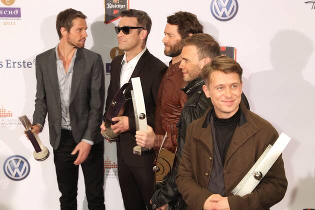 Preistraeger Take That mit Robbie Williams beim Echo 2011 - dem Deutschen Musikpreis an der Preistraeger Wand in der Messe Berlin am Funkturm. Es ist der 20. Echo. 20 Jahre Echo. Copyright: xEventpress Herrmannx