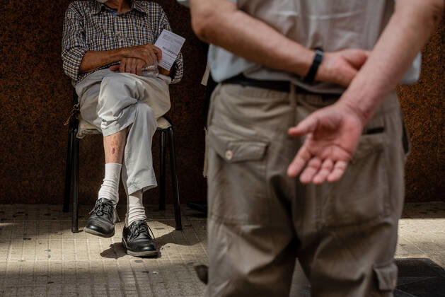 March 9, 2021, Buenos Aires, Argentina: Elderly citizens wait in their seats to receive the Covid19 Vaccination at Luna Park Stadium..Due to the overwhelming numbers and the limited space at the Luna Park stadium, many senior citizens had to wait, sitting in the sun while others had to receive the Covid19 vaccination from specified cars. Buenos Aires Argentina - ZUMAs197 20210309_zaa_s197_128 Copyright: xAlejoxManuelxAvilax