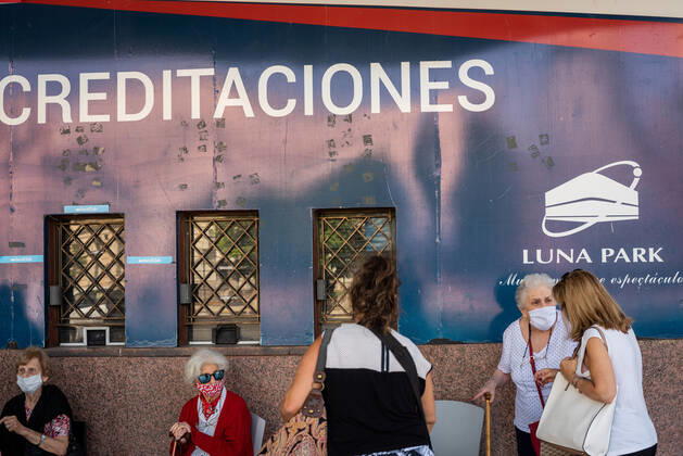 March 9, 2021, Buenos Aires, Argentina: Elderly citizens wait in their seats to receive the Covid19 Vaccination at Luna Park Stadium..Due to the overwhelming numbers and the limited space at the Luna Park stadium, many senior citizens had to wait, sitting in the sun while others had to receive the Covid19 vaccination from specified cars. Buenos Aires Argentina - ZUMAs197 20210309_zaa_s197_131 Copyright: xAlejoxManuelxAvilax