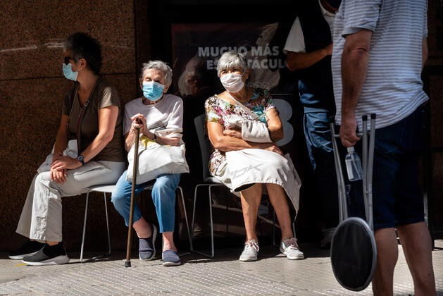 March 9, 2021, Buenos Aires, Argentina: Elderly citizens wait in their seats to receive the Covid19 Vaccination at Luna Park Stadium..Due to the overwhelming numbers and the limited space at the Luna Park stadium, many senior citizens had to wait, sitting in the sun while others had to receive the Covid19 vaccination from specified cars. Buenos Aires Argentina - ZUMAs197 20210309_zaa_s197_132 Copyright: xAlejoxManuelxAvilax