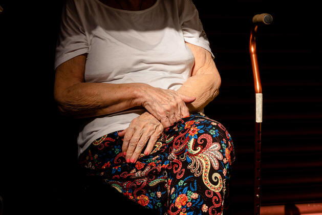March 9, 2021, Buenos Aires, Argentina: An elderly woman waits in her seat to receive the Covid19 Vaccination at Luna Park Stadium..Due to the overwhelming numbers and the limited space at the Luna Park stadium, many senior citizens had to wait, sitting in the sun while others had to receive the Covid19 vaccination from specified cars. Buenos Aires Argentina - ZUMAs197 20210309_zaa_s197_137 Copyright: xAlejoxManuelxAvilax