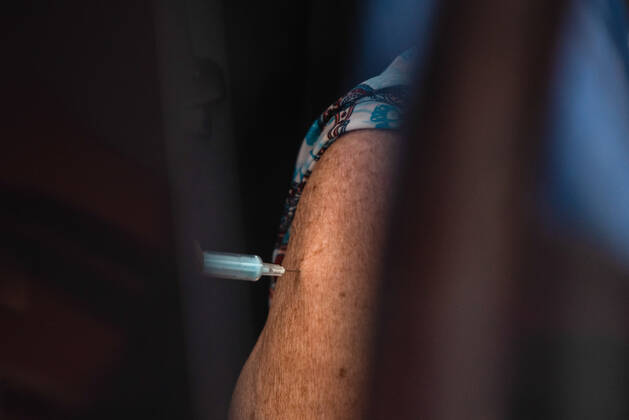 March 9, 2021, Buenos Aires, Argentina: A senior citizen receives Covid19 vaccine inside a car at Luna Park Stadium..Due to the overwhelming numbers and the limited space at the Luna Park stadium, many senior citizens had to wait, sitting in the sun while others had to receive the Covid19 vaccination from specified cars. Buenos Aires Argentina - ZUMAs197 20210309_zaa_s197_139 Copyright: xAlejoxManuelxAvilax