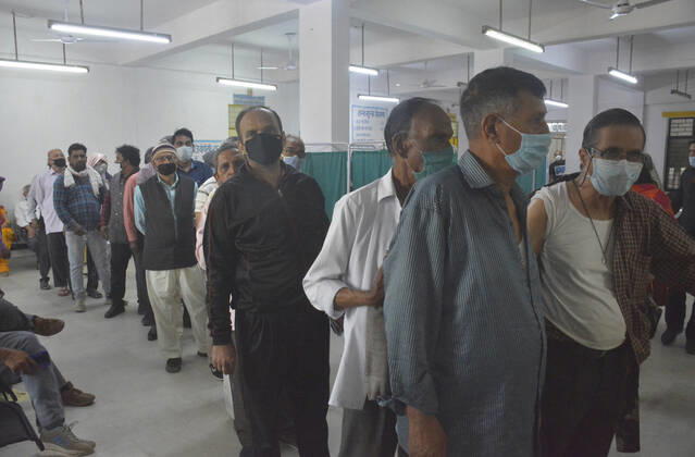 GHAZIABAD, INDIA - MARCH 9: Senior citizens queue during a Covid-19 vaccination drive at District Combined Hospital, Sanjay Nagar, on March 9, 2021 in Ghaziabad, India. (Photo by Sakib Ali Hindustan Times )