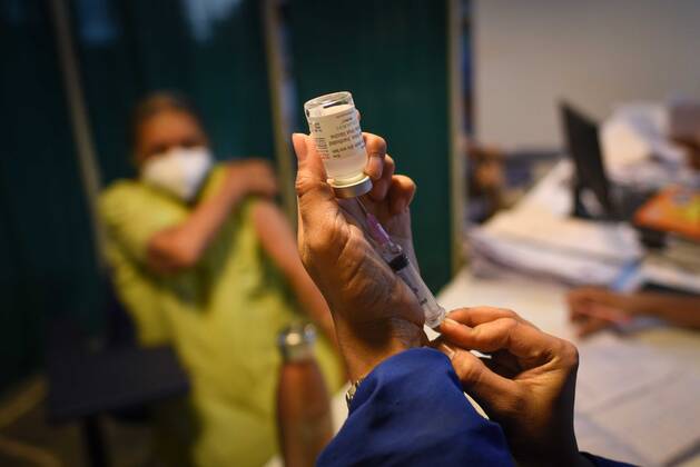 GHAZIABAD, INDIA - MARCH 9: A health worker prepares a dose of Covid-19 vaccine, at a hospital in Bali Nagar in New Delhi, India, on Tuesday, March 9, 2021. (Photo by Sakib Ali Hindustan Times )