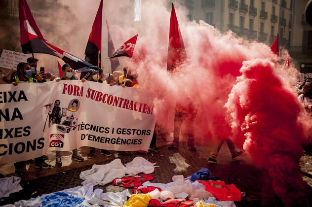 March 10, 2021, Barcelona, Spain: Healthcare workers protest amid smoke as they gather in Barcelona to demand an improvement in their working conditions aggravated by the coronavirus pandemic. Barcelona Spain - ZUMAb137 20210310_zap_b137_007 Copyright: xJordixBoixareux