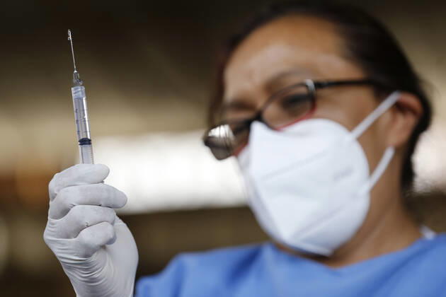 March 10, 2021, Uruapan, Michoacan, Mexico: A nurse prepares a dose of Pfizer-BioNTech Covid-19 vaccine before inject to an elderly, during mass vaccine inside of Hermanos Lopez Rayon sports center, a designated priority vaccination center for elderly over 60 years in the Uruapan town. On March 10, 2021 in Michoacan, Mexico. Uruapan Mexico - ZUMAe321 20210310_zia_e321_003 Copyright: xCarlosxGuzmanx