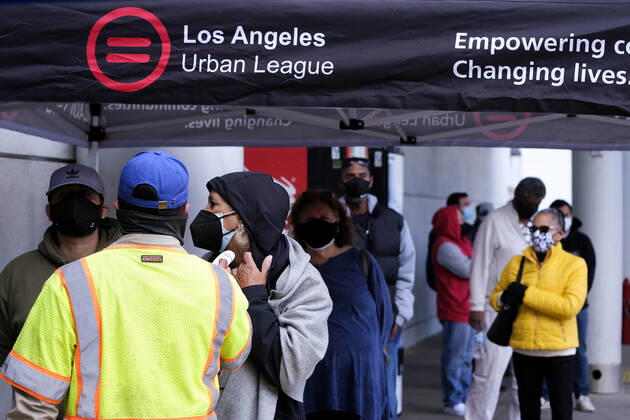 March 11, 2021, Los Angeles, California, USA: A woman gets his temperature taken before to receive the new one-shot Johnson & Johnson COVID-19 vaccine at a vaccination event at Baldwin Hills Crenshaw Plaza in Los Angeles on March 11, 2021. The event was hosted by the California Department of Public Health and FEMA (Federal Emergency Management Agency). The Johnson & Johnson vaccine is now the third coronavirus vaccine to receive emergency approval for use in the United States. Los Angeles USA - ZUMAc68_ 20210311_zaf_c68_011 Copyright: xRingoxChiux