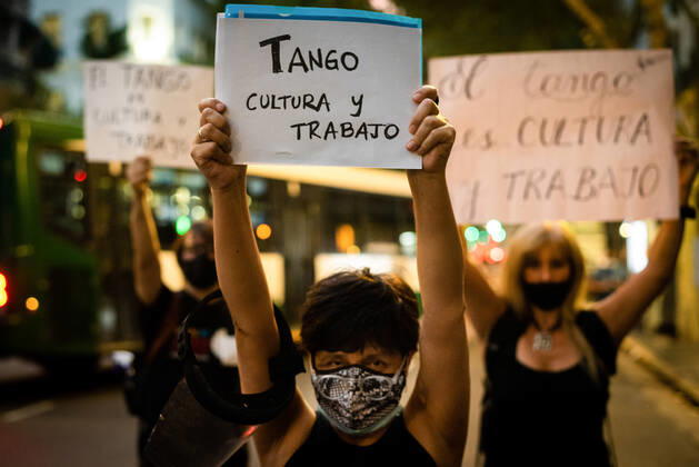 March 11, 2021, Buenos Aires, Argentina: Workers hold placards during the demonstration..Tango workers gathered at the doors of the Ministry of Culture to ask for the resumption of activity in the City of Buenos Aires and show that they have been unable to work for a year. Buenos Aires Argentina - ZUMAs197 20210311_zaa_s197_136 Copyright: xAlejoxManuelxAvilax