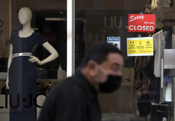 (210311) -- VALLETTA, March 11, 2021 -- A man walks past a closed store in Valletta, Malta, March 11, 2021. The Maltese government on Wednesday announced the closure of schools and non-essential shops in response to a spike in new COVID-19 cases, almost two-thirds of which are attributable to the variant first reported in the UK. The new measures, which will be in force until April 11, include the closure of all non-essential shops and those providing non-essential services such as hairdressers and beauticians while the limitation of group gatherings in public down to a maximum of four people. (Photo by Xinhua) MALTA-VALLETTA-COVID-19-RESTRICTIONS JonathanxBorg 