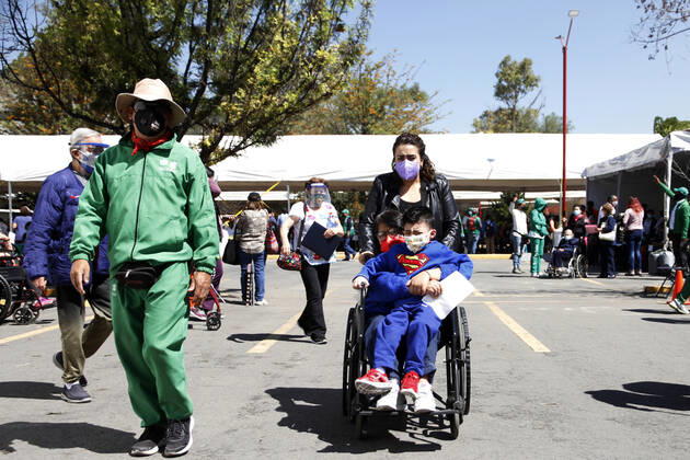 MEXICO CITY, MEXICO - MARCH 11: Staff of various social programmes, support to elderly over to move in wheelchairs to arrive at the facilities of the Autonomous Metropolitan University Azcapotzalco, where health workers apply the Pfizer BioNTech Covid19 vaccine to adults over 60 years of age, in the Third Stage of Vaccination. On March 11, 2021 in in Mexico City, Mexico.. Credit: Luis Barron Eyepix Group The Photo Access Increased COVID Vaccination for Elderly in Mexico  Copyright: xLuisxBarronx