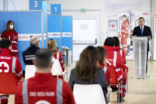 (210313) -- ROME, March 13, 2021 () -- Italian Prime Minister Mario Draghi speaks at the mass COVID-19 vaccination hub at Fiumicino Airport in Italy, on March 12, 2021. Speaking at a COVID-19 hub at the Fiumicino international airport in the Italian capital on Friday, Prime Minister Mario Draghi pledged to accelerate the national vaccination campaign, which has reached some 6.3 million people so far, according to government s figures. (Pool via ) ITALY-ROME-PM-COVID-19 VACCINATION HUB-VISIT Xinhua 